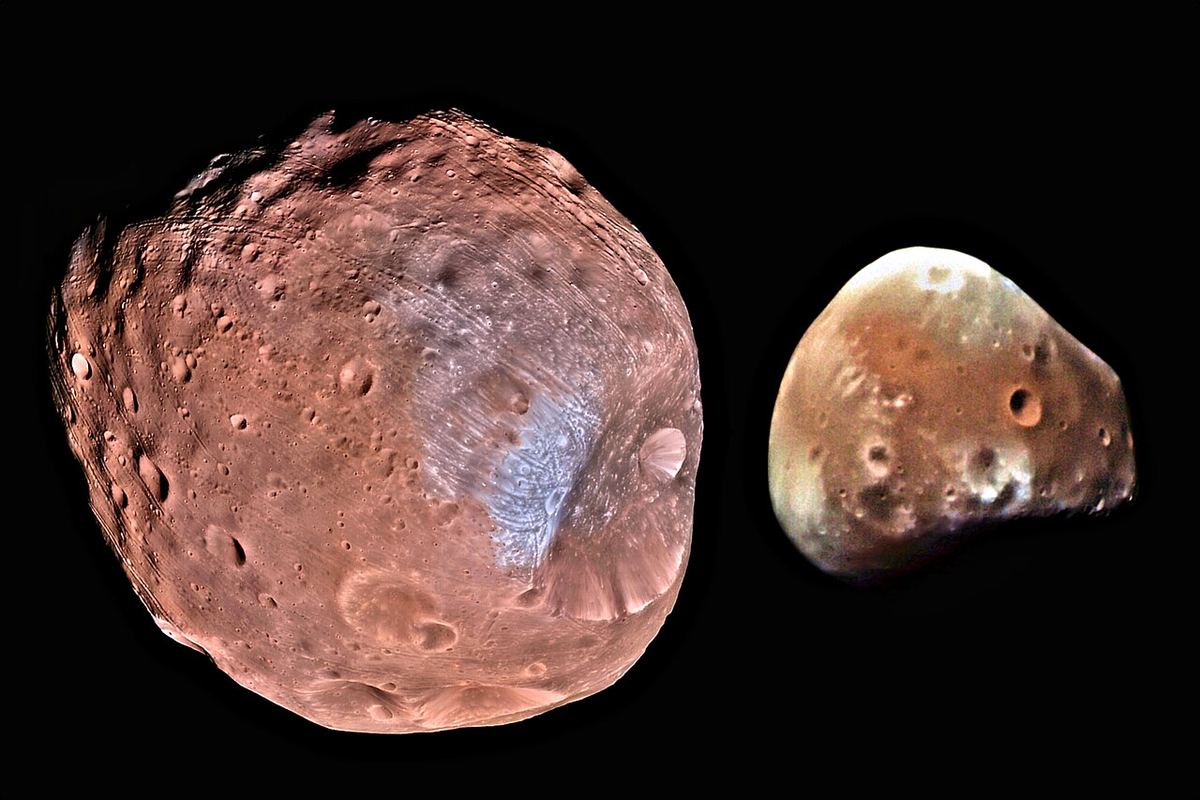 Mars' two small, cratered moons, Phobos and the smaller Deimos, side by side against black space